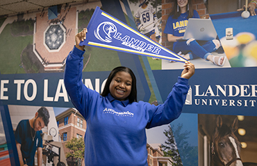 student with pennant