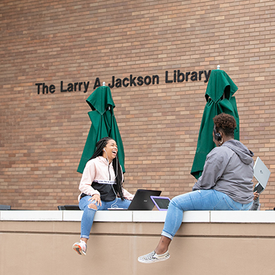 students outside library
