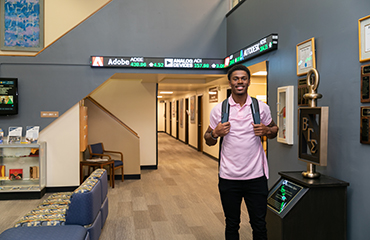 student in Business lobby