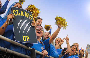 Bearcat mascots with family