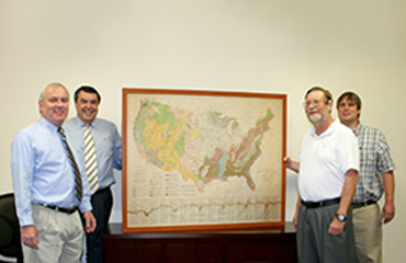 officials with rare map