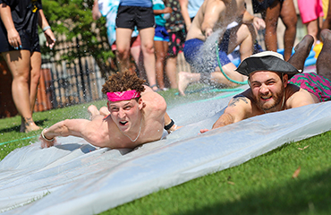 students on water slide