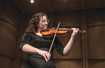 student playing violin