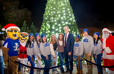 Richard Cosentino and students at tree lighting