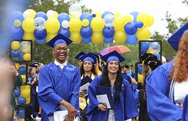 graduates at commencement