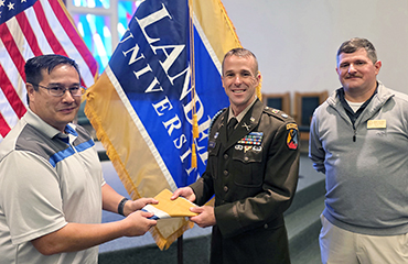 Maj. Adrian Chen, Lt. Col. Ed Moore and Brent Delgado 