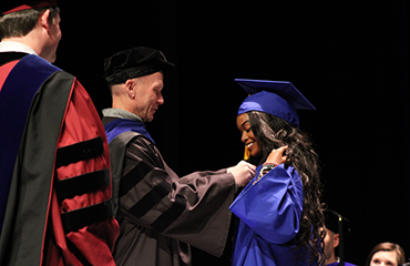 Erin Postell receives her pin