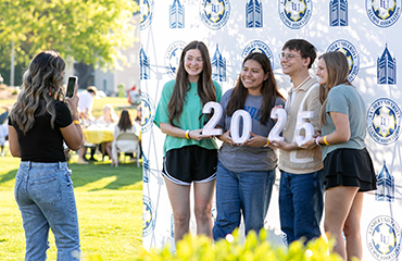 graduates at alumni event