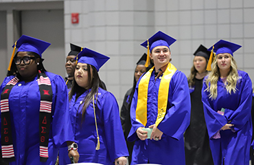 fall graduates at ceremony