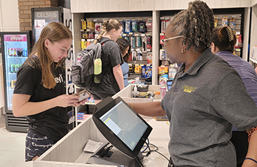 student making a purchase