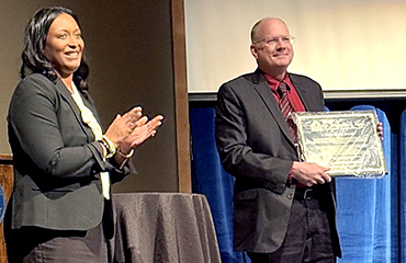 James Colbert accepts award